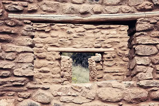 Windows looking through ancient walls of stone and mud.