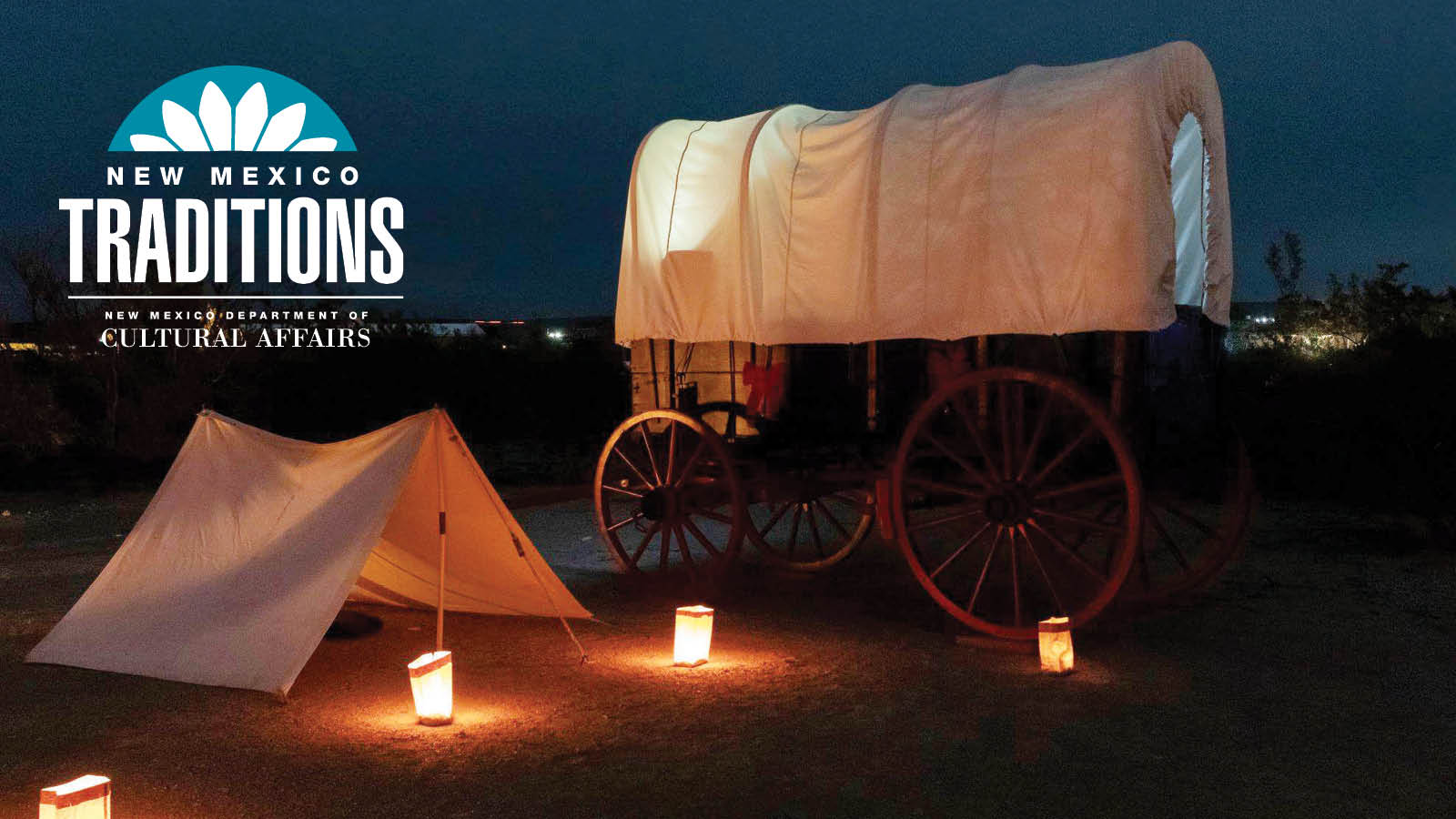NMTraditions_1600x900 chuckwagon New Mexico Traditions, New Mexico Department of Cultural Affairs. Late evening. with chuck wagon and 18th century tent, lit up by farolitos
