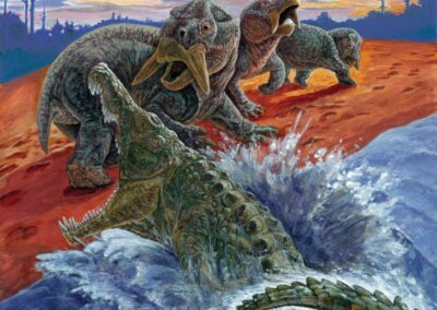 Illustration of a phytosaur, a large crocodilian reptile, lunging out of blue water toward a group of startled, beaked Placerias on a red riverbank under a sunset sky.